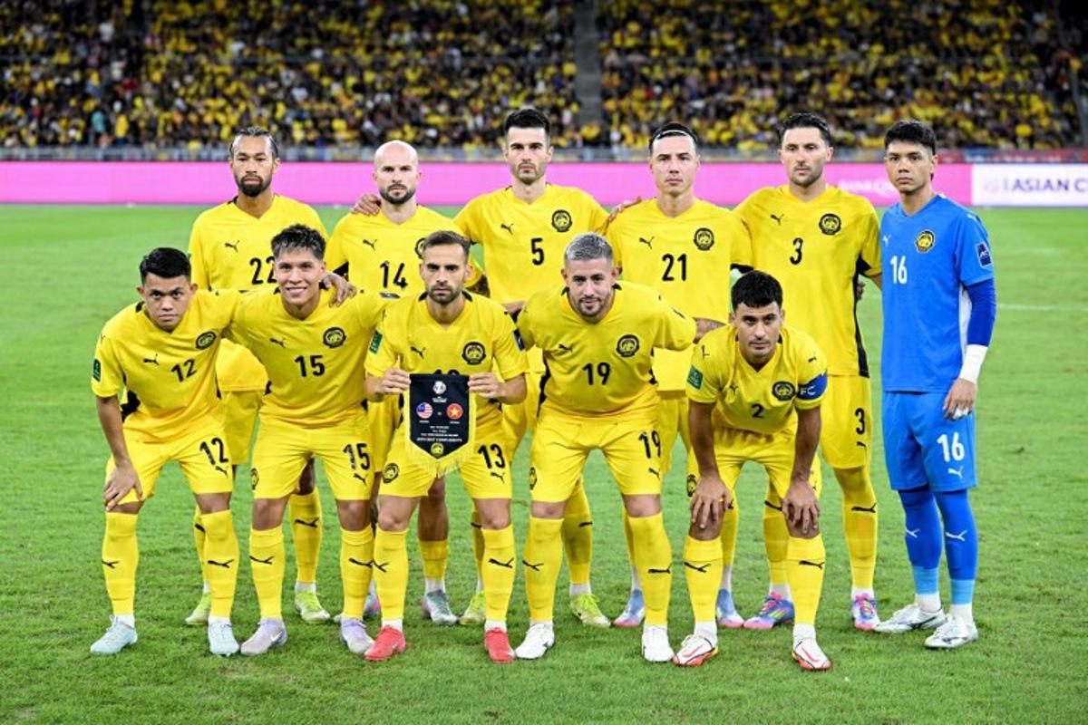 Malaysia's players pose before the start of the AFC Asian Cup qualifier Group F football match between Malaysia and Vietnam at the National Stadium Bukit Jalil in Kuala Lumpur on June 10, 2025. Mohd RASFAN / AFP