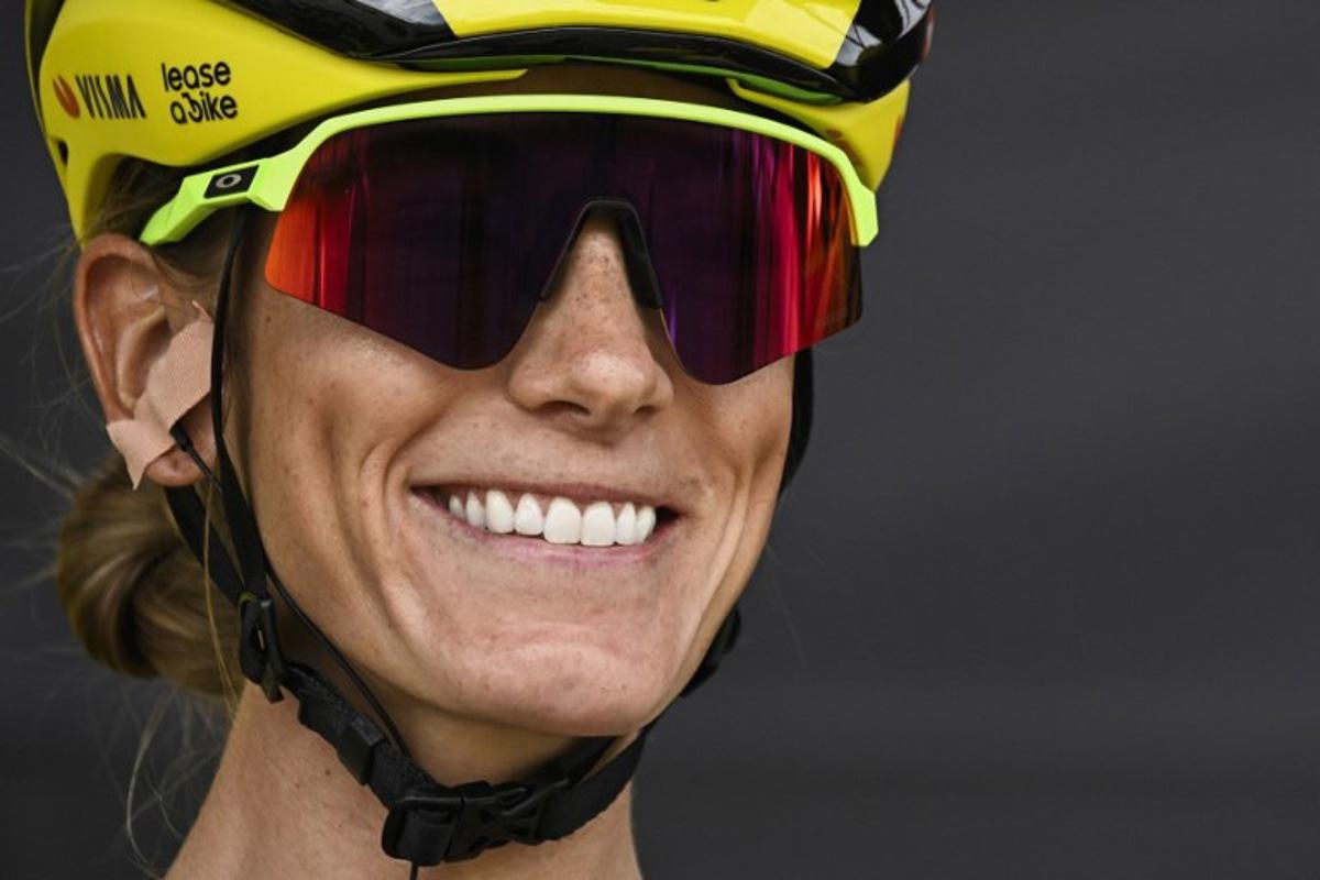 Team Visma | Lease a Bike's French rider Pauline Ferrand-Prevot smiles as she awaits the start of the 5th stage (out of 9) of the fourth edition of the Women's Tour de France cycling race, 165.8 km from Chasseneuil-du-Poitou to Gueret, central France on July 30, 2025. JULIEN DE ROSA / AFP