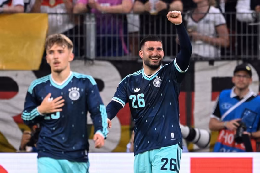 Germany's forward #26 Deniz Undav (R) celebrates scoring his team's first goal with Germany's midfielder #25 Lennart Karl during a friendly match between Germany and Finland ahead of the 2026 FIFA World Cup football tournament, in Mainz, western Germany on May 31, 2026. Kirill KUDRYAVTSEV / AFP