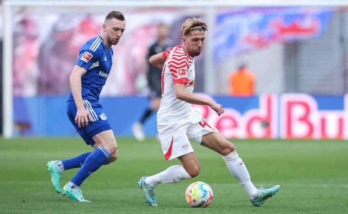 Leipzig's Slovenian midfielder Kevin Kampl (R) and Schalke's German midfielder Tobias Mohr vie for the ball during the German first division Bundesliga football match between RB Leipzig and FC Schalke 04 in Leipzig, eastern Germany on May 27, 2023. Ronny Hartmann / AFP