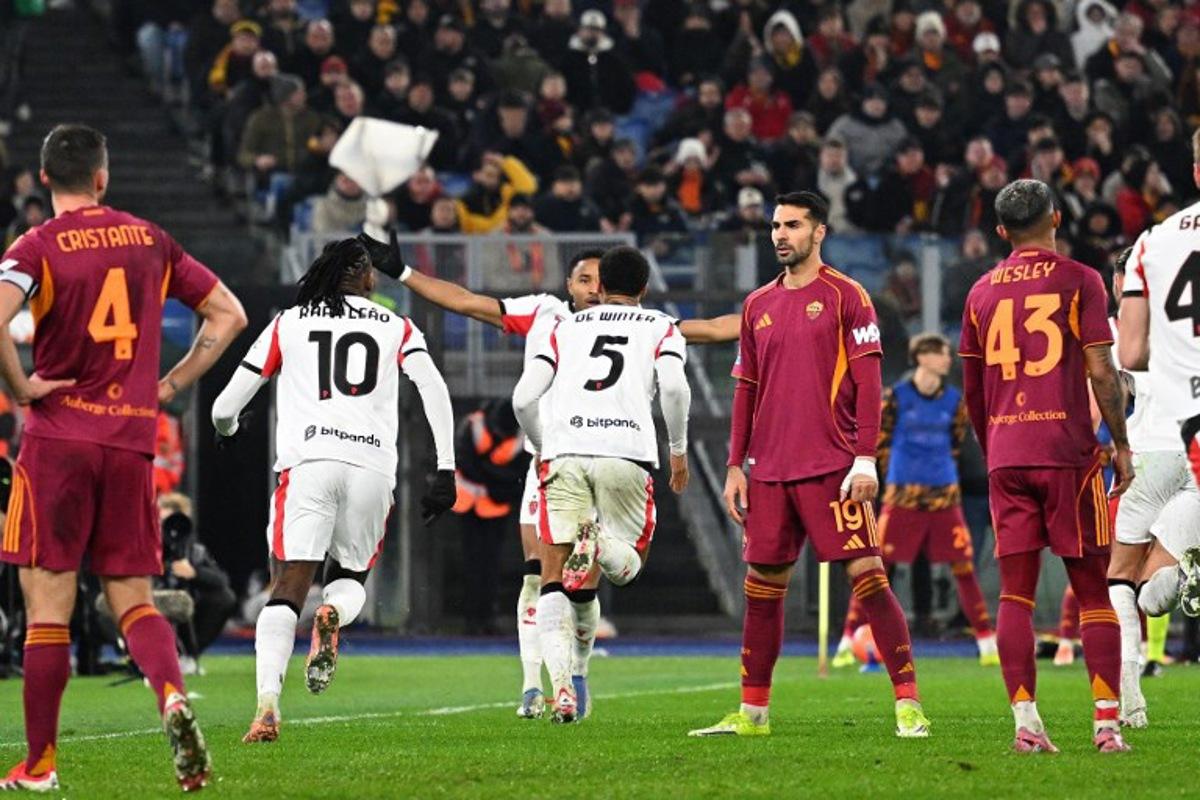 AC Milan's Belgian defender #05 Koni De Winter (C) celebrates after scoring a goal during the Italian Serie A football match between AS Roma and Milan at the Olympic Stadium in Rome on January 25, 2026. Andreas SOLARO / AFP