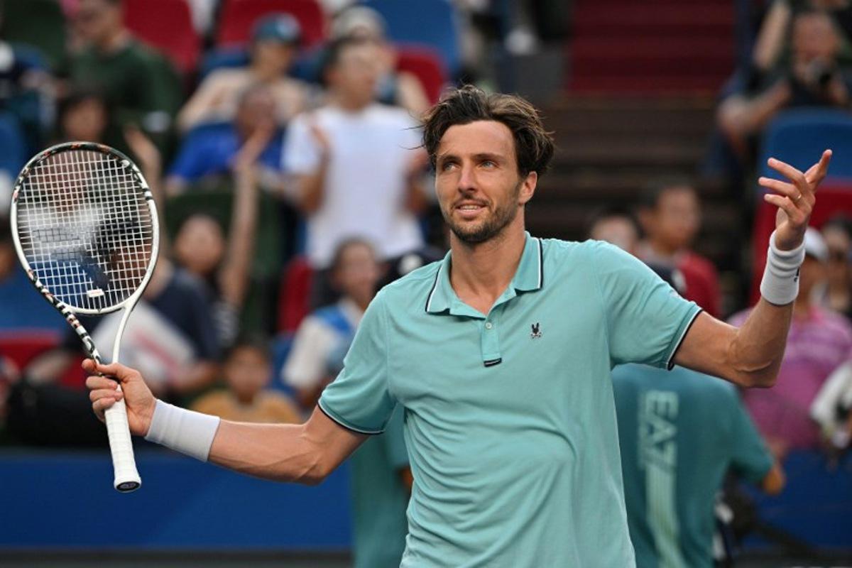 France's Arthur Rinderknech celebrates after winning against Canada's Felix Auger-Aliassime during their quarter-final men's singles match at the Shanghai Masters tennis tournament in Shanghai on October 10, 2025. Hector RETAMAL / AFP