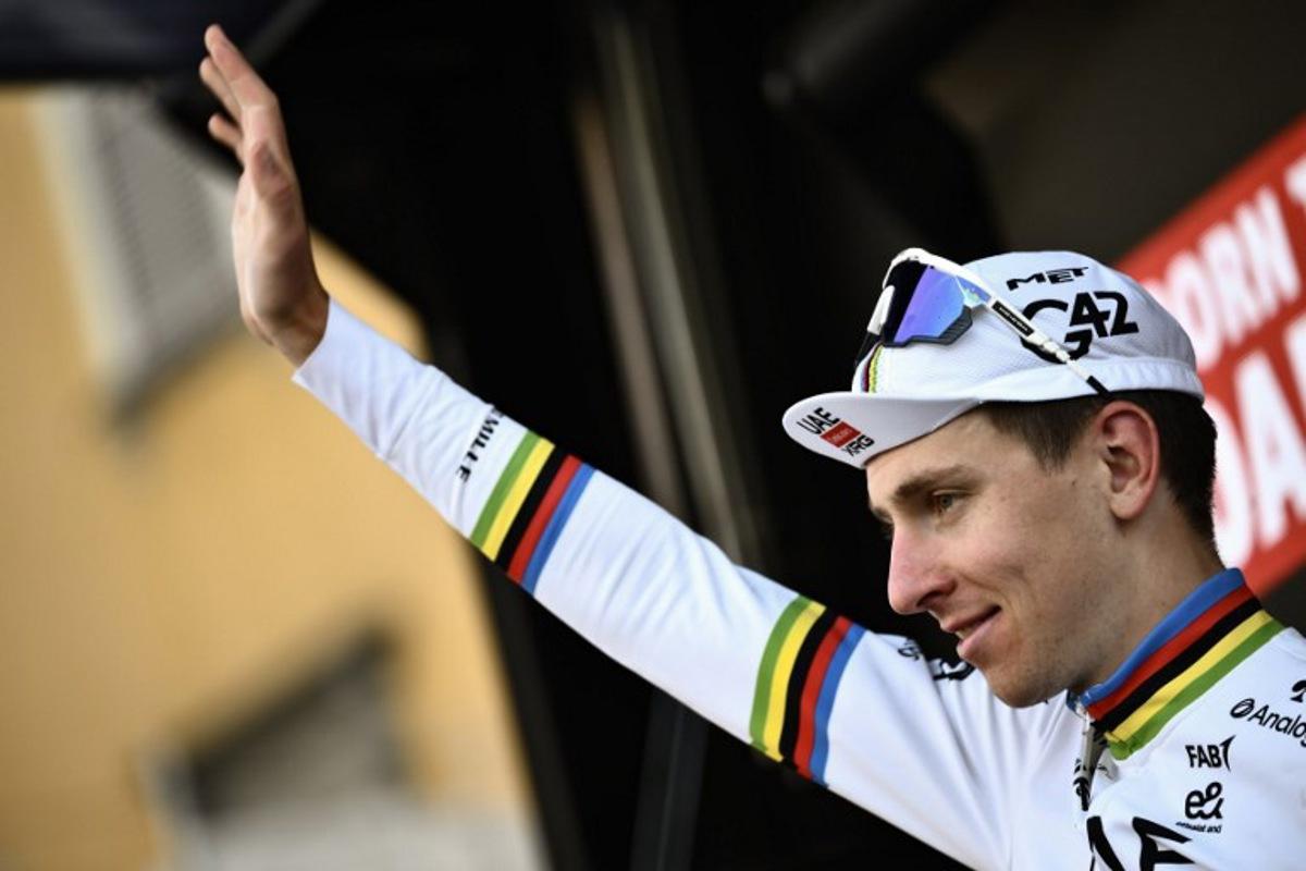 UAE Team Emirates's Slovenian rider Tadej Pogacar celebrates his victory on the podium after the 119th edition of the Giro di Lombardia (Tour of Lombardy), a 238km cycling race from Como to Bergamo on October 11, 2025. Marco BERTORELLO / AFP