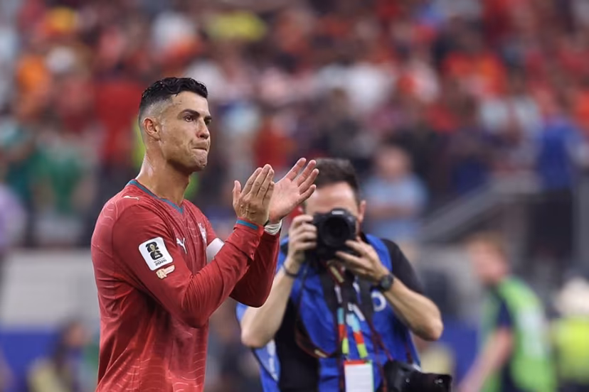 Portugal's forward #07 Cristiano Ronaldo greets fans after losing the 2026 World Cup round of 16 football match between Portugal and Spain at the Dallas Stadium in Arlington on July 6, 2026. Thomas COEX / AFP