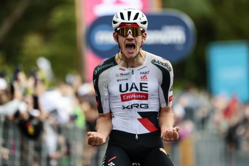 UAE Team Emirates - XRG Spanish rider Igor Arrieta celebrates as he crosses the finish line to win the 5th stage of the Giro d'Italia 2026 - Tour of Italy cycling race between Praia a Mare and Potenza, southern Italy on May 13, 2026. Luca BETTINI / AFP