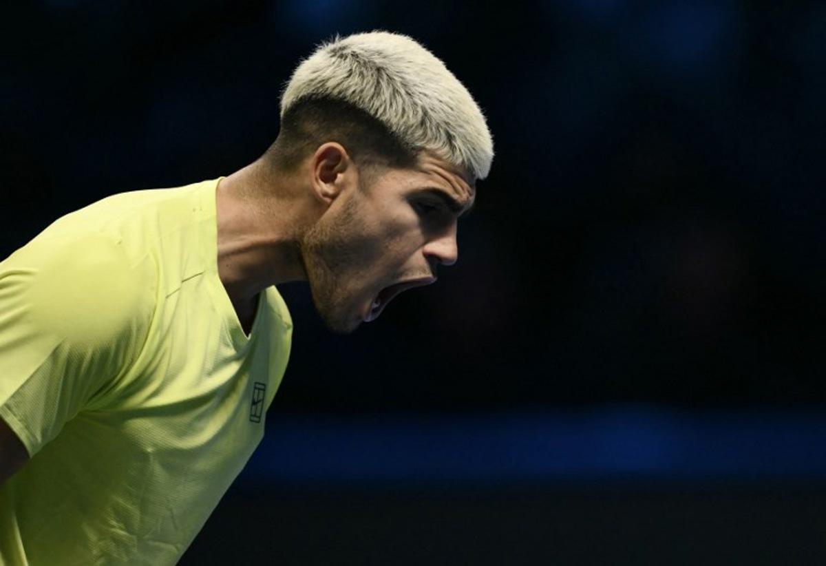 Spain's Carlos Alcaraz reacts during the match against USA's Taylor Fritz during the ATP Finals tennis tournament in Turin on November 11, 2025. Marco BERTORELLO / AFP