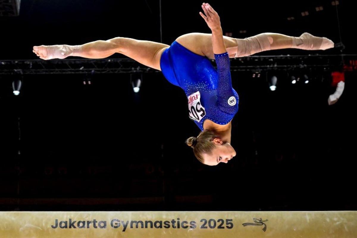 Russia's Angelina Melnikova competes as Individual Neutral Athletes on the uneven bars during the women's qualifying session at the 53rd FIG Artistic Gymnastics World Championships in Jakarta on October 21, 2025. BAY ISMOYO / AFP