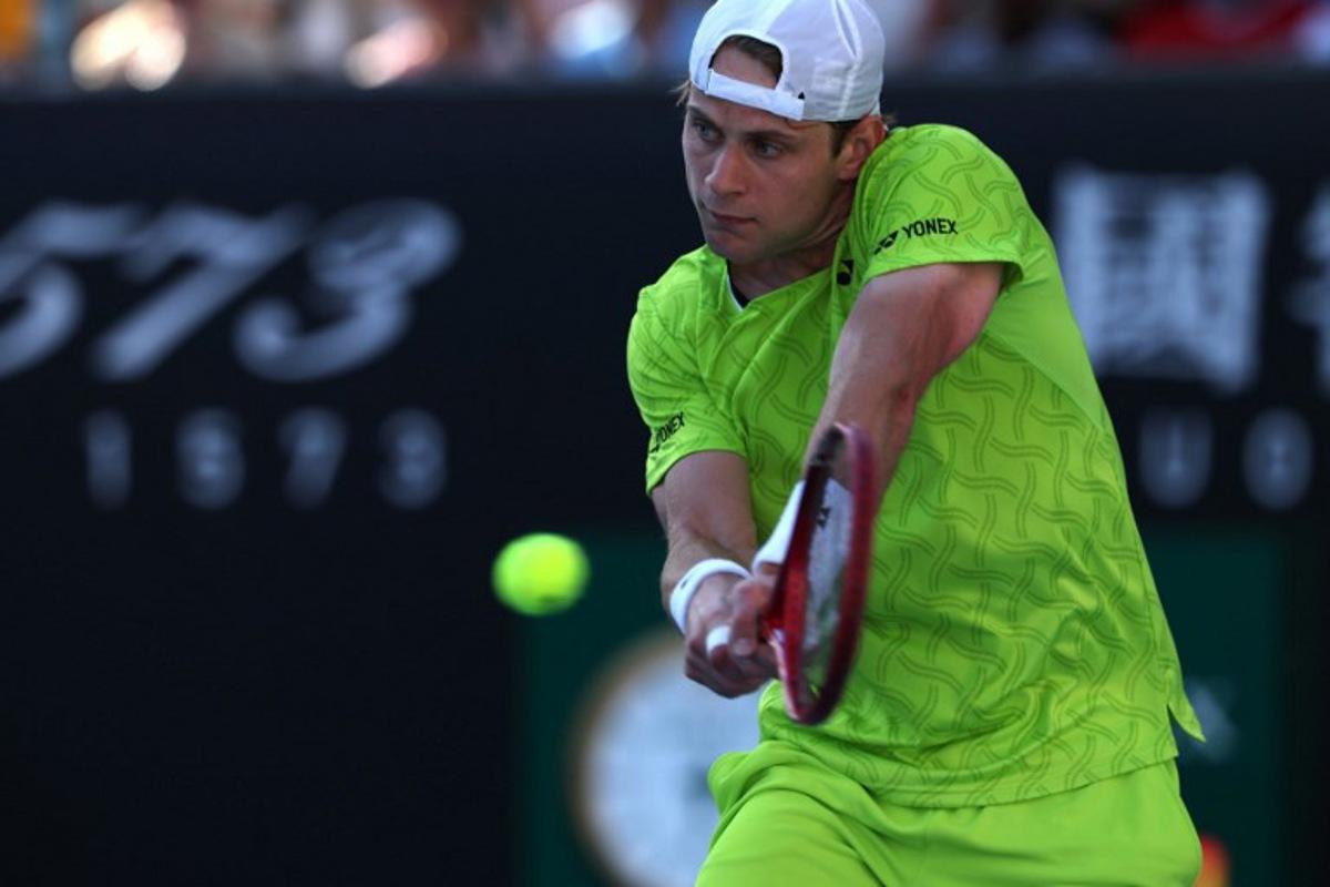 Belgium's Zizou Bergs hits a shot against Poland's Hubert Hurkacz during their men's singles match on day three of the Australian Open tennis tournament in Melbourne on January 20, 2026. IZHAR KHAN / AFP