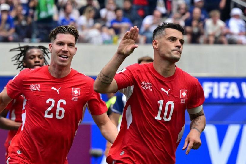Switzerland's midfielder #10 Granit Xhaka celebrates scoring his team's fourth goal during the 2026 World Cup Group B football match between Switzerland and Bosnia and Herzegovina at Los Angeles Stadium in Inglewood on June 18, 2026. Frederic J. Brown / AFP