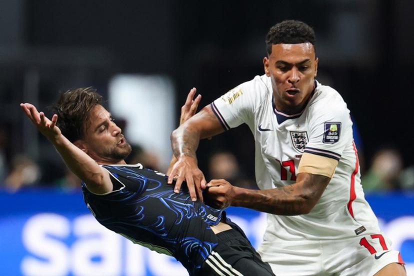England's midfielder #17 Morgan Rogers (R) and Argentina's defender #03 Nicolas Tagliafico fight for the ball during the 2026 World Cup football tournament semi-final match between England and Argentina at the Atlanta Stadium in Atlanta on July 15, 2026. Odd ANDERSEN / AFP