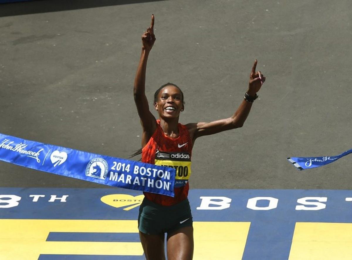 Rita Jeptoo of Kenya reacts as she crosses the finish line to win the Women's Elite division of the 118th Boston Marathon in Boston, Massachusetts April 21, 2014. AFP PHOTO / Timothy A. CLARY TIMOTHY A. CLARY / AFP