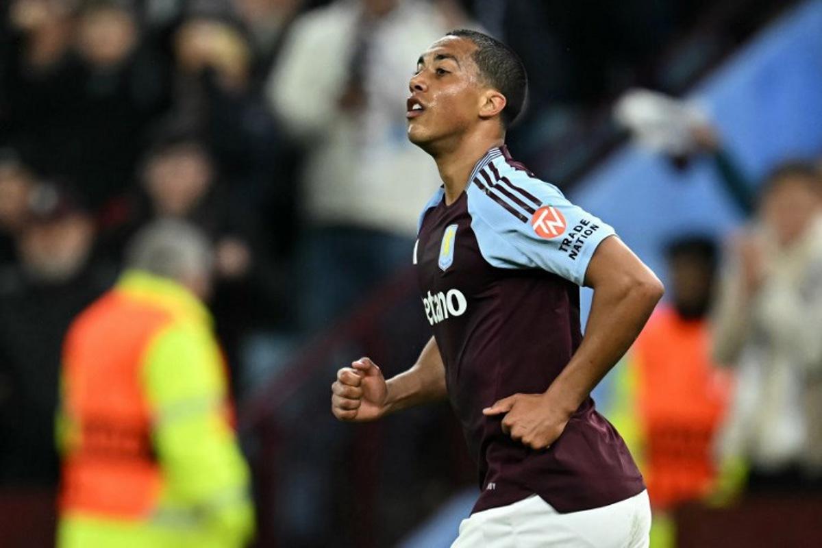 Aston Villa's Belgian midfielder #08 Youri Tielemans reacts after scoring the team's second goal during the UEFA Champions League quarter-final second-leg football match between Aston Villa and Paris Saint-Germain at Villa Park in Birmingham, central England on April 15, 2025. Paul ELLIS / AFP
