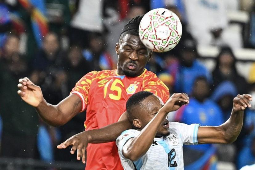 Democratic Republic Of Congo's defender #15 Rocky Bushiri and Botswana's defender #12 Mothusi Johnson vie during the Africa Cup of Nations (CAN) Group D football match between Botswana and Democratic Republic of Congo at El Madina Stadium in Rabat on December 30, 2025. SEBASTIEN BOZON / AFP