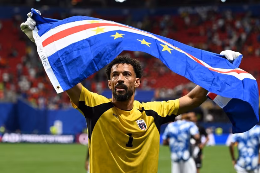 Cape Verde's goalkeeper #01 Vozinha celebrates with his national flag at the end of the 2026 World Cup Group H football match between Spain and Cape Verde at the Atlanta Stadium in Atlanta on June 15, 2026. ROBERTO SCHMIDT / AFP