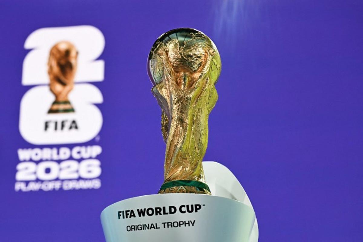 This photograph shows the 2026 FIFA World Cup trophy following the 2026 FIFA World Cup European Play-Off draw at the FIFA's Home of Football in Zurich on November 20, 2025. Fabrice COFFRINI / AFP
