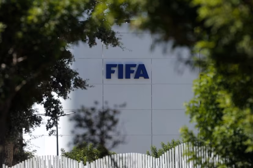 The FIFA logo is seen at its Africa regional office in Sale on August 5, 2026. President Gianni Infantino held emergency talks with other FIFA directors in Morocco on August 5, a source told AFP, amid a wave of criticism over his now shelved plan to open the World Cup to private investment. Abdelmajid BZIOUAT / AFP