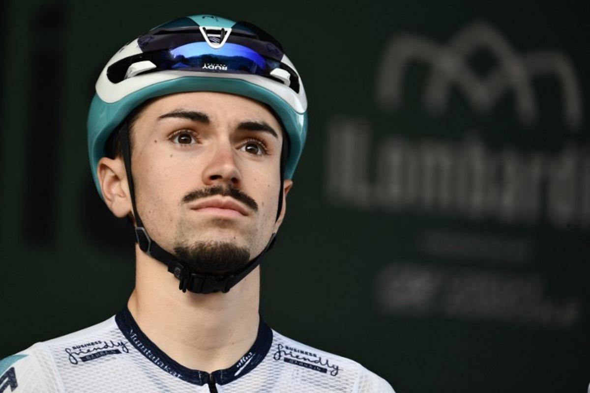 Bahrain Victorious's French rider Lenny Martinez looks on from the sign-in podium ahead of the 119th edition of the Giro di Lombardia (Tour of Lombardy), a 238km cycling race from Como to Bergamo on October 11, 2025. Marco BERTORELLO / AFP