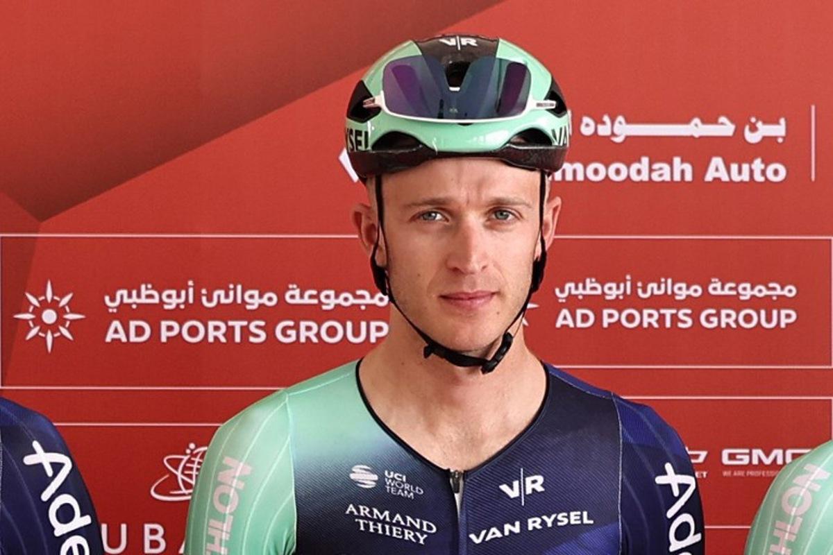 Decathlon CMA CGM Team's Belgian rider Robbe Ghys poses on stage ahead of the first stage of the UAE Tour cycling event from Madinat Zayed Majlis to Liwa Palace in Abu Dhabi on February 16, 2026. Fadel SENNA / AFP