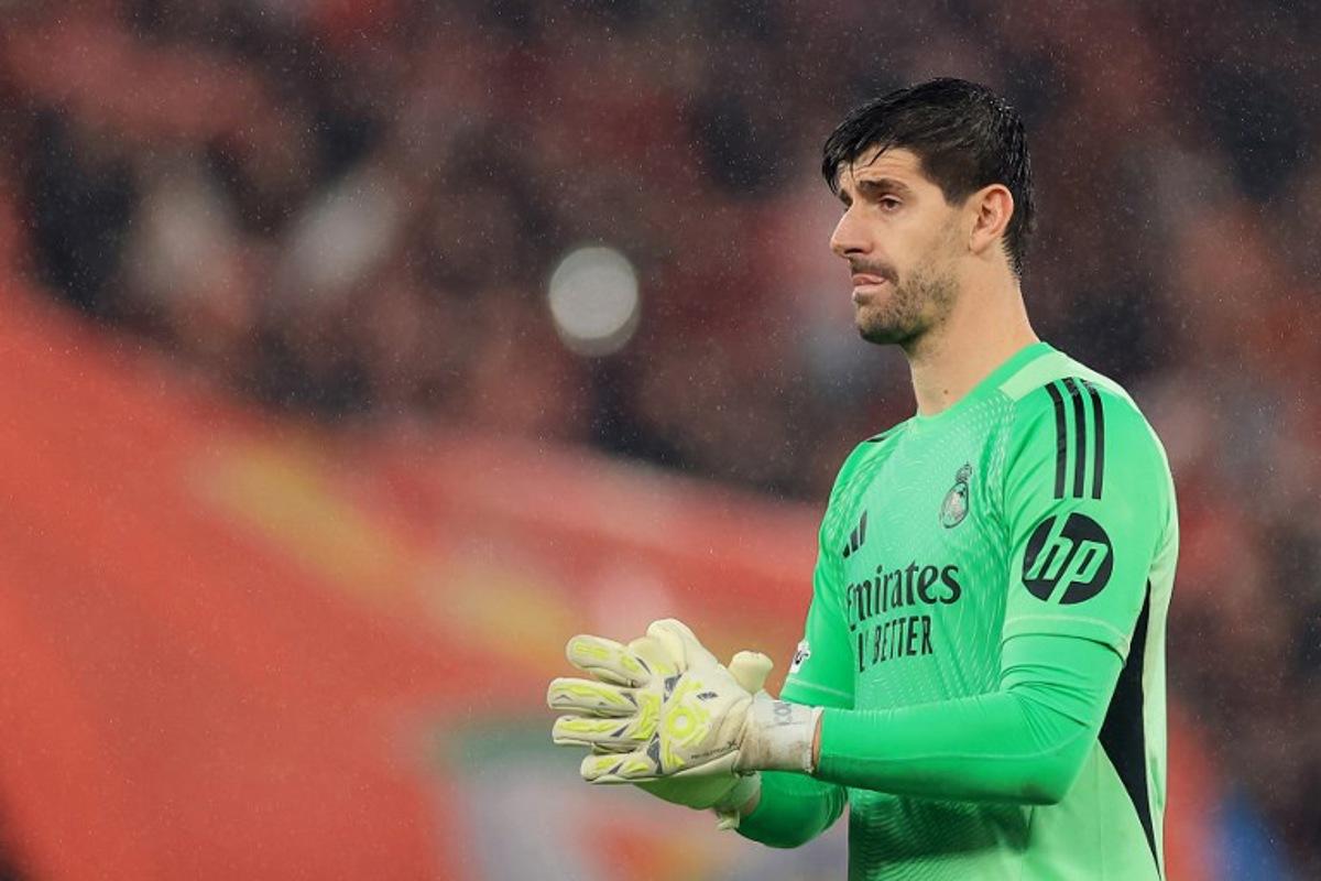 Real Madrid's Belgian goalkeeper #01 Thibaut Courtois gestures at the end of the UEFA Champions League league phase day 8 football match between SL Benfica and Real Madrid CF at Estadio da Luz in Lisbon on January 28, 2026. PATRICIA DE MELO MOREIRA / AFP