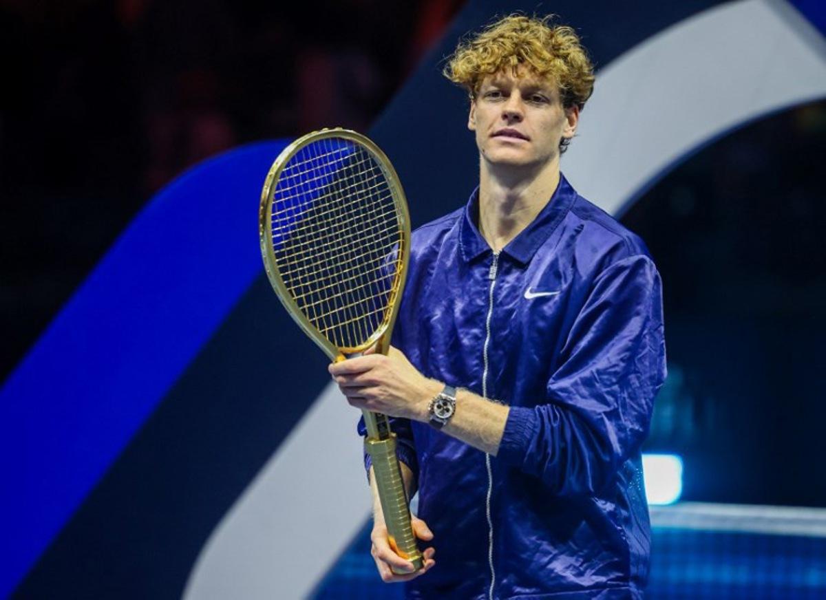 Italy's Jannik Sinner holds up his winning trophy, the Golden Racquet, after defeating Spain's Carlos Alcaraz in the final of the Six Kings Slam exhibition tennis tournament in Riyadh on October 18, 2025. Fayez NURELDINE / AFP