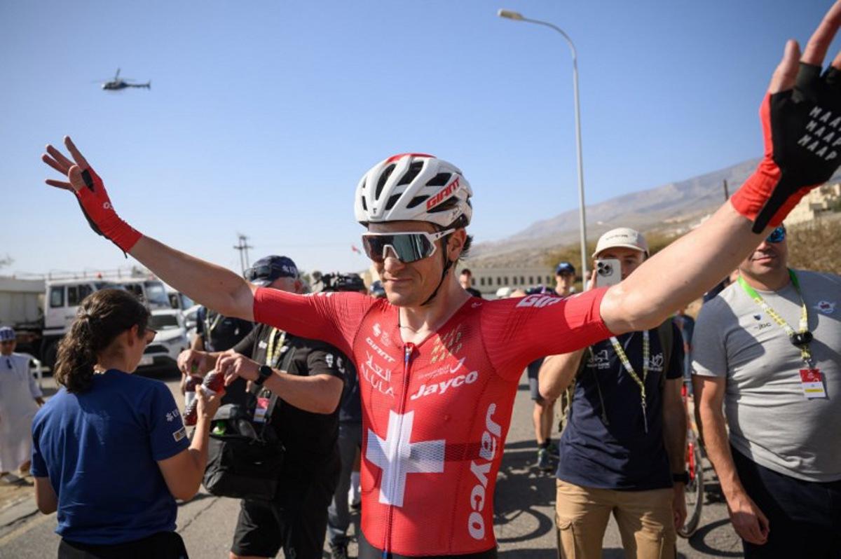 Team Jayco AlUla Swiss rider Mauro Schmid celebrates after winning the 3d stage of the Tour of Oman cycling race from Samail "Al Fayhaa Resthouse" to Misfat Al Abriyeen, on February 9, 2026. Loic VENANCE / AFP