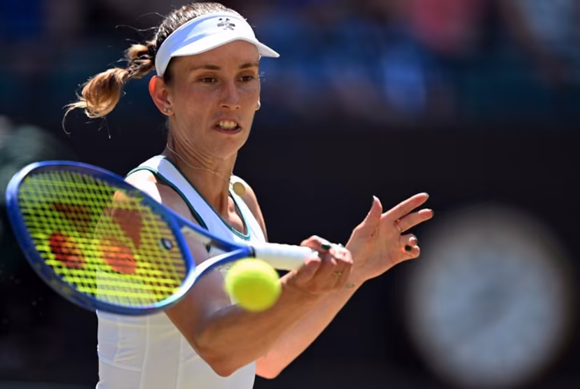Belgium's Elise Mertens returns to Czech Republic's Linda Noskova during their women's singles quarter-final tennis match on the tenth day of the 2026 Wimbledon Championships at The All England Lawn Tennis and Croquet Club in Wimbledon, southwest London, on July 8, 2026. Kirill KUDRYAVTSEV / AFP