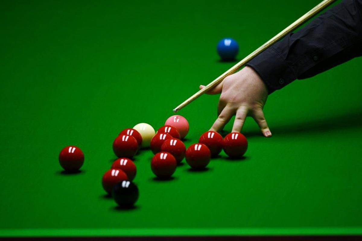 Jackson Page of Wales plays a shot during the World Snooker Championship Round Two match against Mark Williams of Wales at the Crucible Theatre, in Sheffield, northern England, on April 22, 2022. OLI SCARFF / AFP