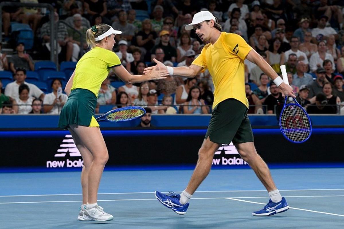 Australia's Alex de Minaur (R) and Storm Hunter celebrate a point against Czech Republic's Dalibor Svrcina and Miriam Skoch during their mixed doubles match at the United Cup tennis tournament on Ken Rosewall Arena in Sydney on January 6, 2026. Izhar KHAN / AFP