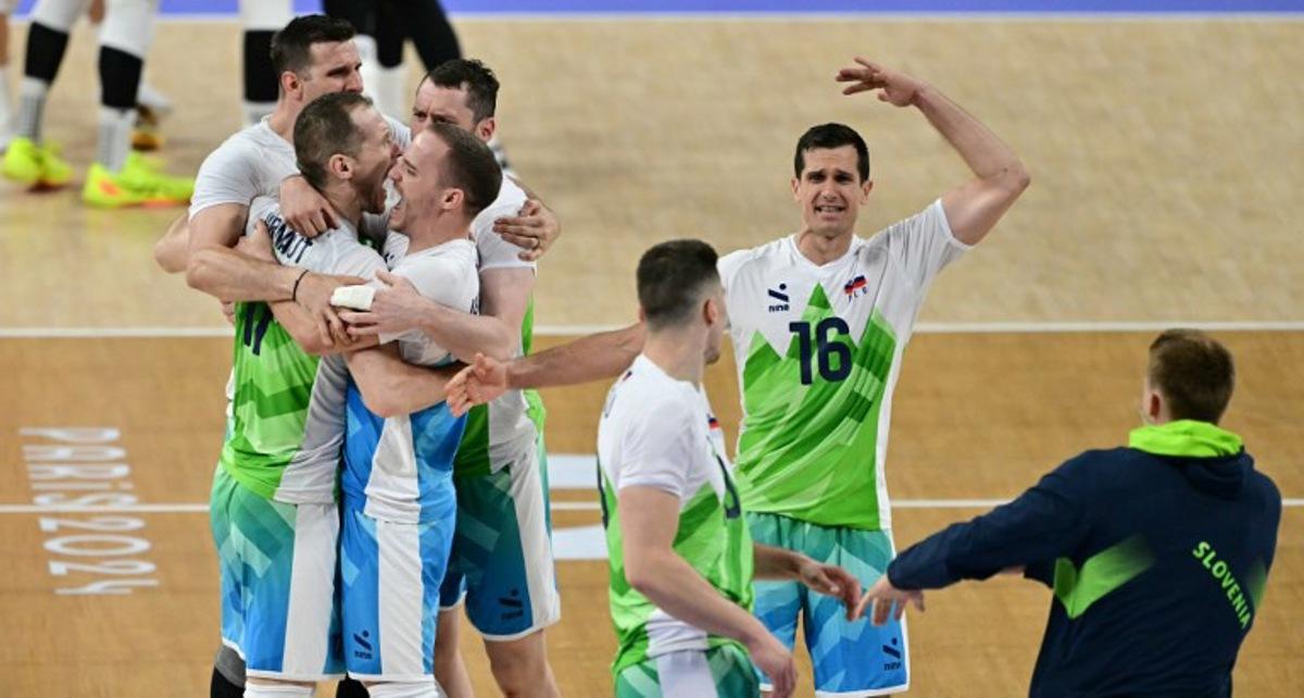 Slovenia's #16 Gregor Ropret (2R) and team mates celebrate during the volleyball men's quarter-final match between Slovenia and Poland during the Paris 2024 Olympic Games at the South Paris Arena 1 in Paris on August 5, 2024. Miguel MEDINA / AFP