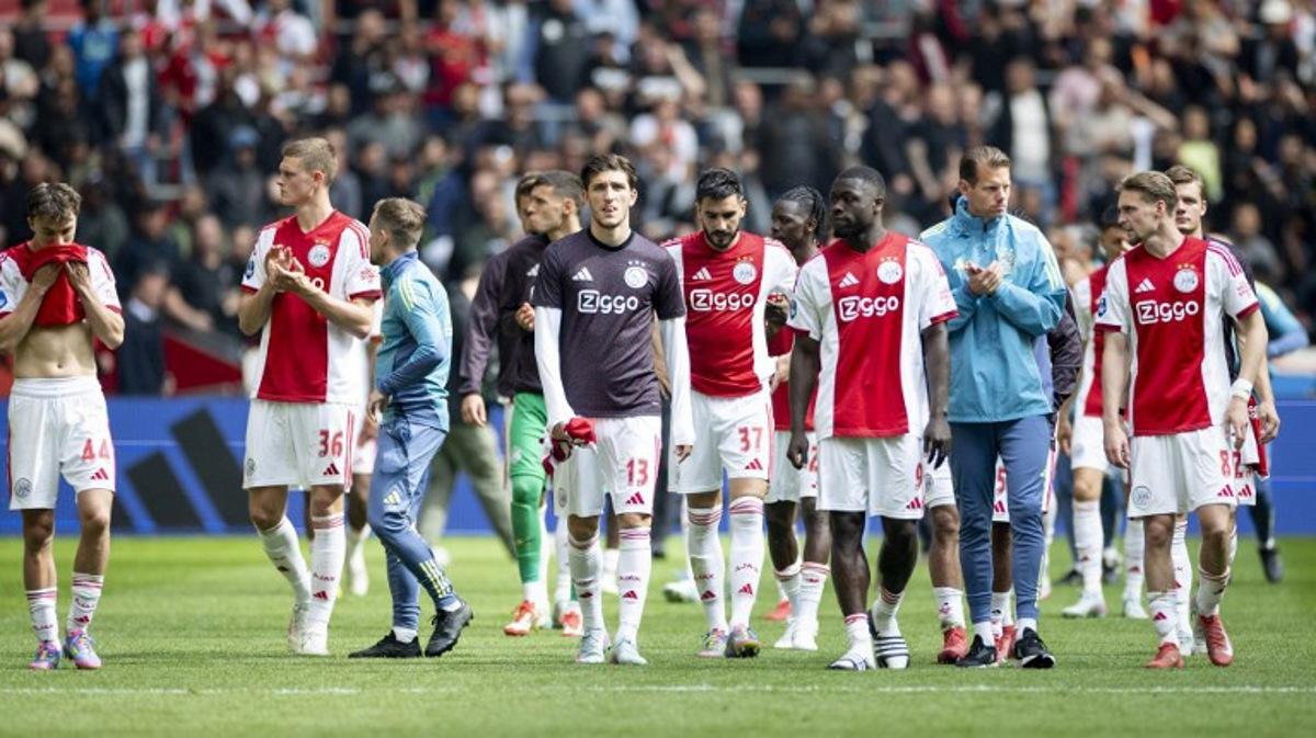 Ajax players celebrate after winning the Dutch Eredivisie football match between Ajax Amsterdam and FC Twente at the Johan Cruijff ArenA, in Amsterdam on May 18, 2025. Koen van Weel / ANP / AFP
