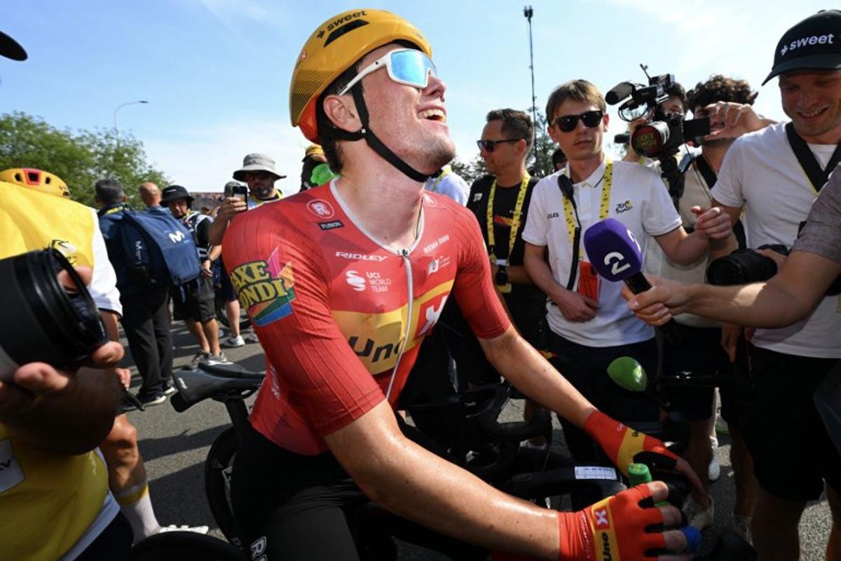 Uno-X Mobility team's Norwegian rider Soren Waerenskjold celebrates after winning the 11th stage of the 113th edition of the Tour de France cycling race, 161,3 km between Vichy and Nevers in central France, on July 15, 2026. Tim De Waele / POOL / AFP