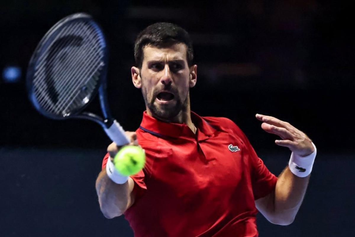 Serbia's Novak Djokovic hits a return against US' Taylor Fritz during the third-placed match at the Six Kings Slam exhibition tennis tournament in Riyadh on October 18, 2025. Fayez NURELDINE / AFP