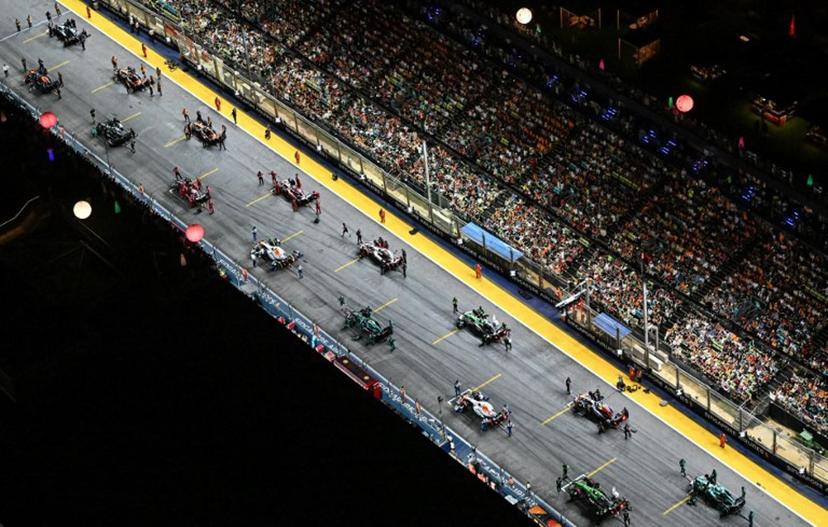 Drivers prepare to take the start of the Formula One Singapore Grand Prix night race at the Marina Bay Street Circuit in Singapore on October 5, 2025. ROSLAN RAHMAN / AFP