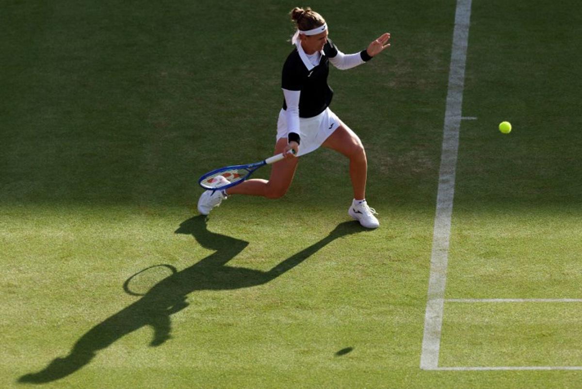 Czech Republic's Marie Bouzkova returns against Croatia's Donna Vekic during their round of 16 women's singles match at the HSBC WTA tennis Championships at Queen's Club in west London on June 10, 2026. Adrian Dennis / AFP