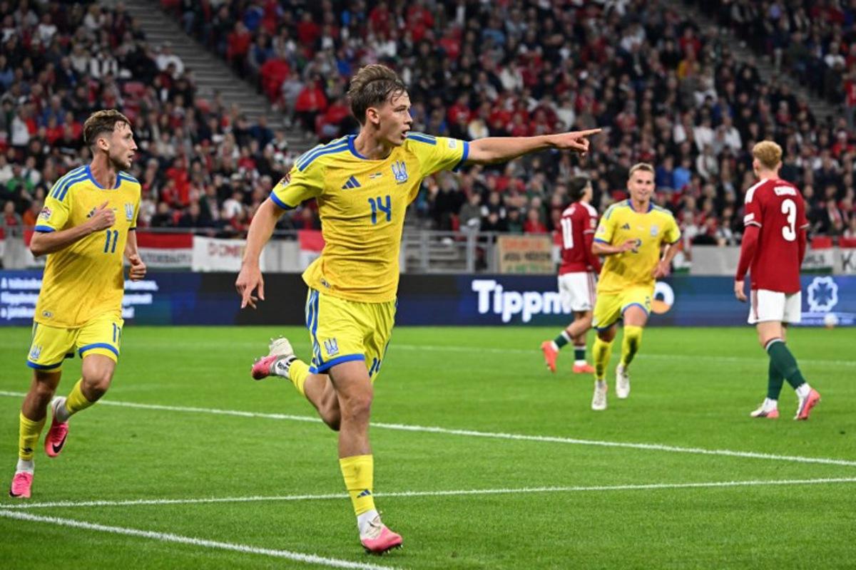 Ukraine's forward Danylo Sikan (2L) celebrates scoring his team's first goal during the UEFA Nations League Group B2 football match between Hungary and Ukraine in Budapest, Hungary on September 25, 2026. Attila KISBENEDEK / AFP