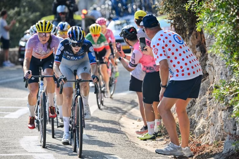 FDJ-SUEZ's French rider Juliette Berthet (C) and UAE Team ADQ's Spanish rider Paula Blasi (L) ride in the peloton in the Col d'Eze during the 9th and final stage of the fifth edition of the Women's Tour de France cycling race, 99.2 km from Nice to Nice, southeastern France on August 9, 2026. NICOLAS TUCAT / AFP