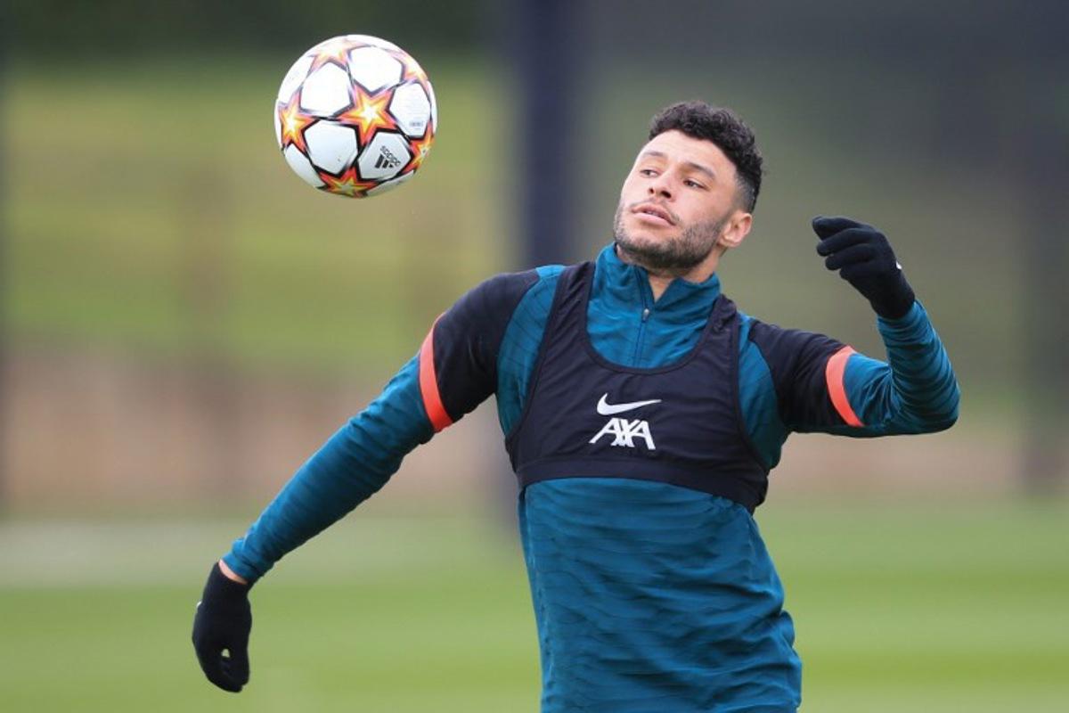 Liverpool's English midfielder Alex Oxlade-Chamberlain controls the ball as he attends a team training session at Anfield Stadium in Liverpool, north west England, on April 26, 2022, on the eve of their UEFA Champions League semi-final first leg football match against Villareal. Lindsey Parnaby / AFP