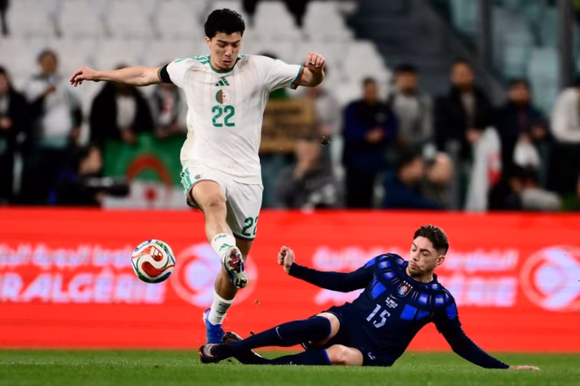 Algeria's midfielder #22 Ibrahim Maza (L) fights for the ball with Uruguay's midfielder #15 Federico Valverde (R) during the friendly international football match between Algeria and Uruguay at the Allianz Stadium in Turin on March 31, 2026. MARCO BERTORELLO / AFP