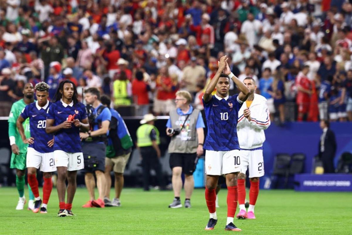 France's forward #10 Kylian Mbappe reacts after losing the 2026 World Cup football tournament semi-final match between France and Spain at the Dallas Stadium in Arlington on July 14, 2026. CHARLY TRIBALLEAU / AFP