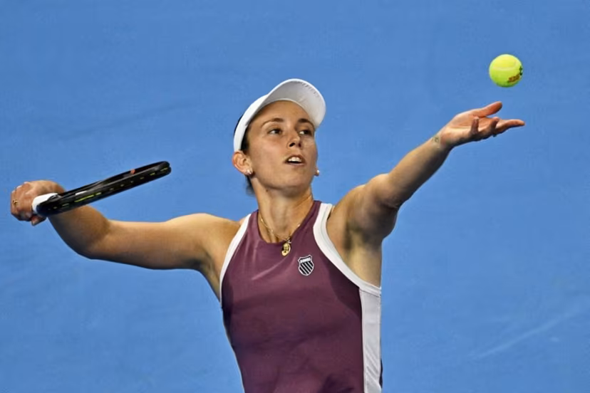 Belgium's Elise Mertens serves to China's Zheng Qinwen during their women's singles semi-final at the China Open tennis tournament in Beijing on October 10, 2026. Pedro PARDO / AFP