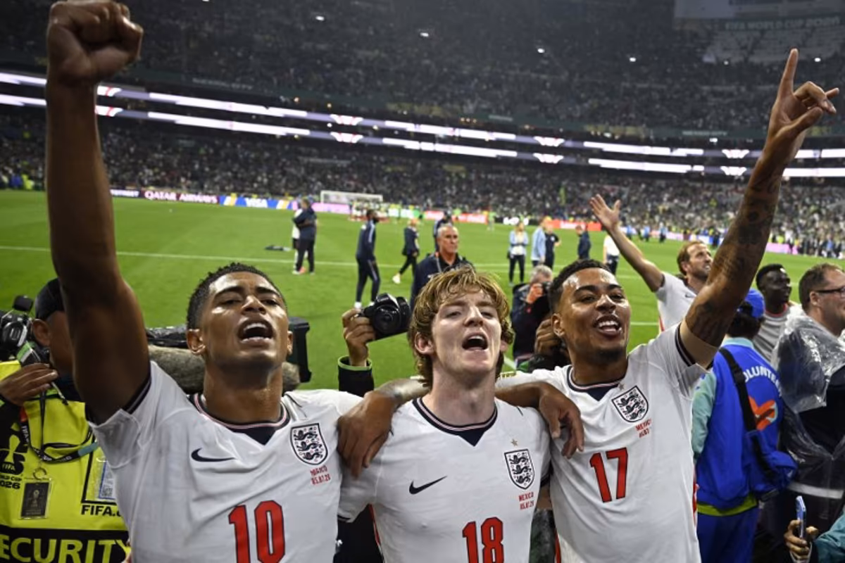 England's midfielder #10 Jude Bellingham, forward #18 Anthony Gordon and midfielder #17 Morgan Rogers celebrate after winning the 2026 World Cup round of 16 football match between Mexico and England at the Mexico City Stadium in Mexico City on July 5, 2026. Alfredo ESTRELLA / AFP