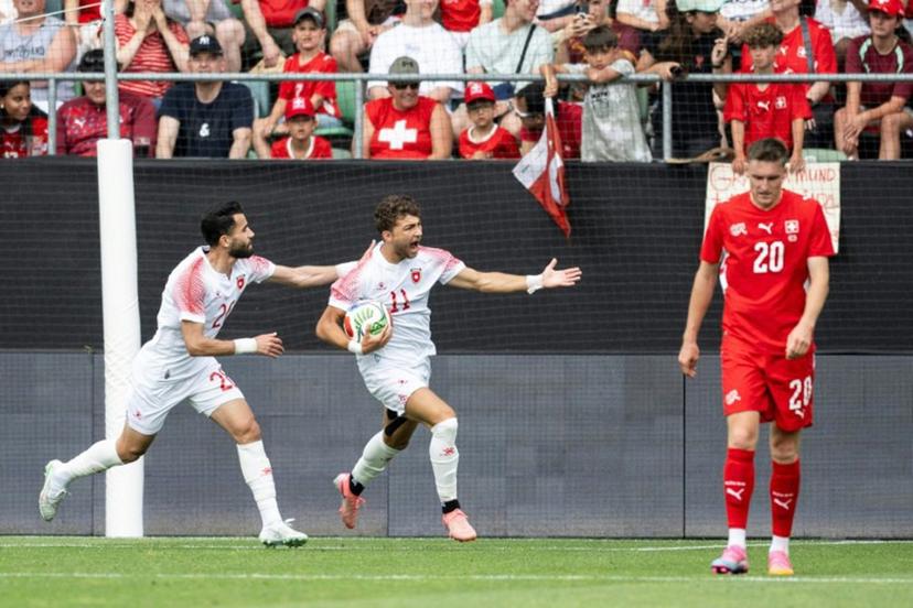 Jordan's forward #11 Odeh Fakhoury (C) celebrates scoring his team's first goal during a friendly match between Switzerland and Jordan ahead of the 2026 FIFA World Cup football tournament at the Kybunpark stadium, in St. Gallen, on May 31, 2026. Ennio LEANZA / AFP