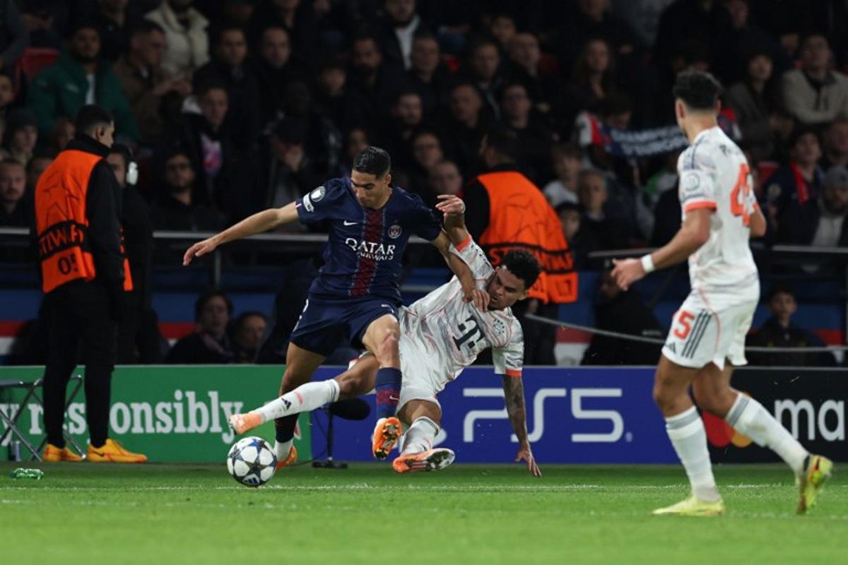 Bayern Munich's Colombian forward #14 Luis Diaz (R) tackles Paris Saint-Germain's Moroccan defender #02 Achraf Hakimi during the UEFA Champions League, league phase day 4, football match between Paris Saint-Germain (PSG) and FC Bayern Munich at the Parc des Princes in Paris, on November 4, 2025. Thomas SAMSON / AFP