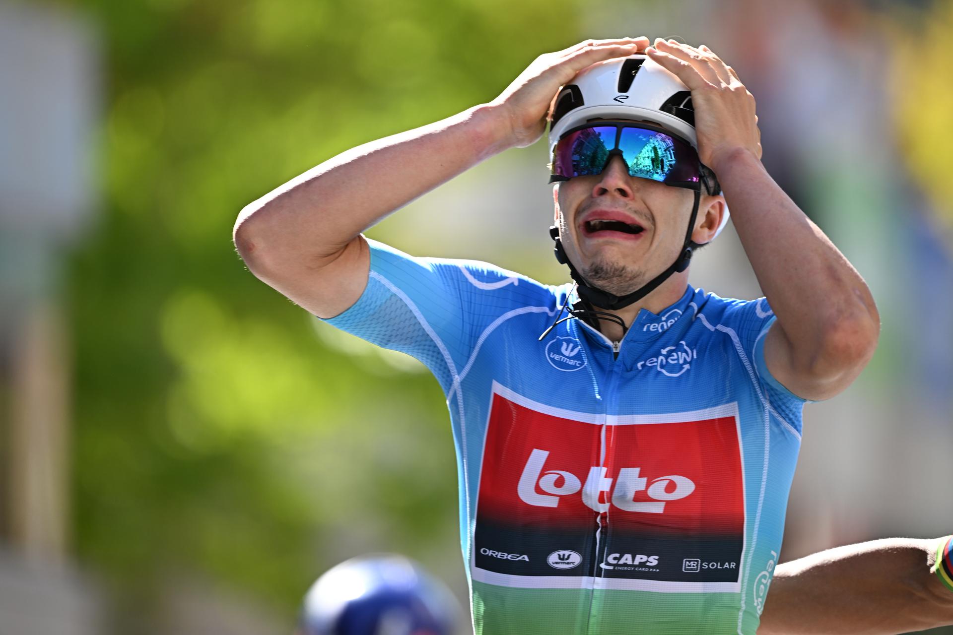 Belgian Arnaud De Lie of Lotto Cycling Team celebrates as he crosses the finish line to win the fifth and last stage of the 'Renewi Tour' multi-stage cycling race, 185km from and to Leuven on Sunday 24 August 2025. The five-day race takes place in Belgium and the Netherlands. BELGA PHOTO DAVID PINTENS