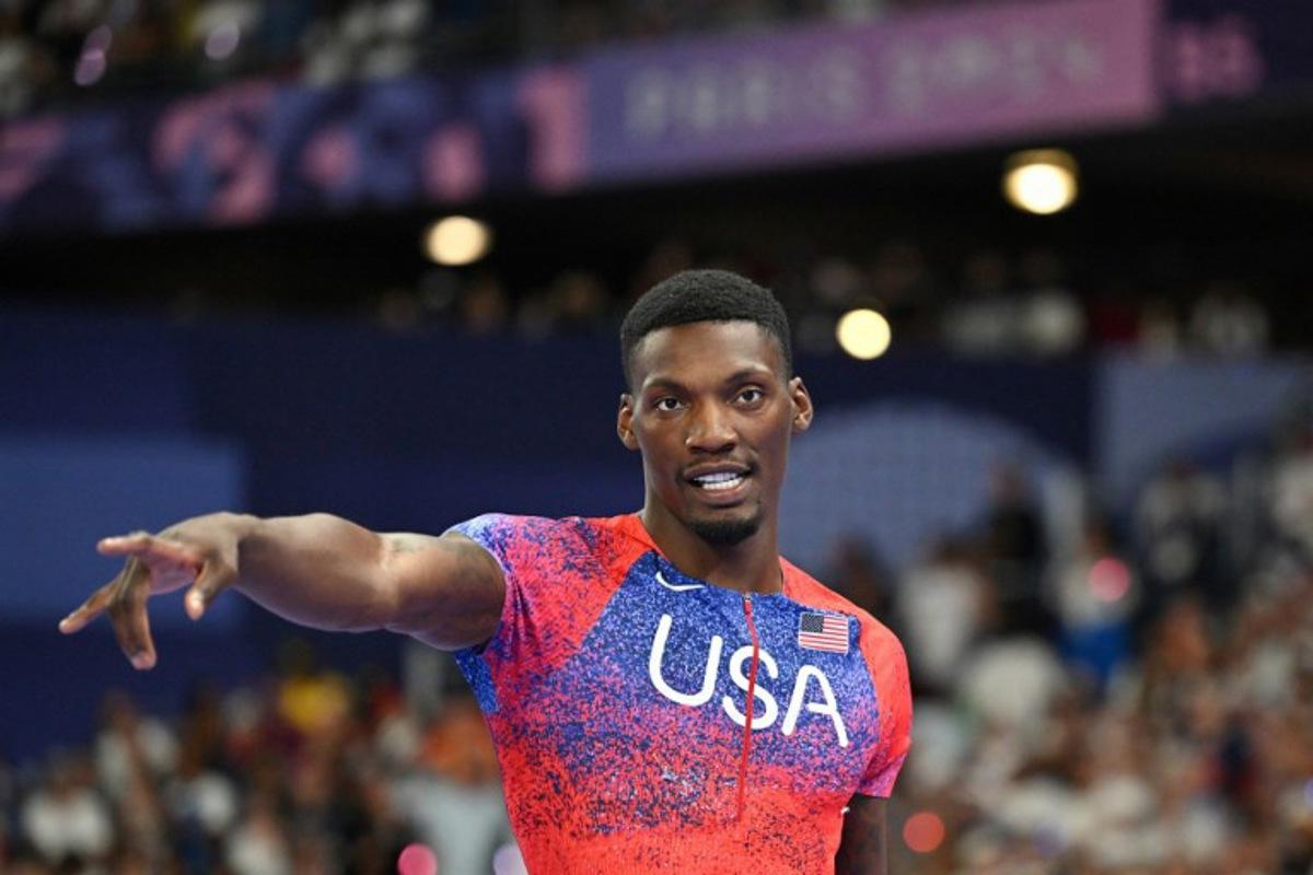 US' Fred Kerley celebrates after winning bronze in the men's 100m final of the athletics event at the Paris 2024 Olympic Games at Stade de France in Saint-Denis, north of Paris, on August 4, 2024. Andrej ISAKOVIC / AFP