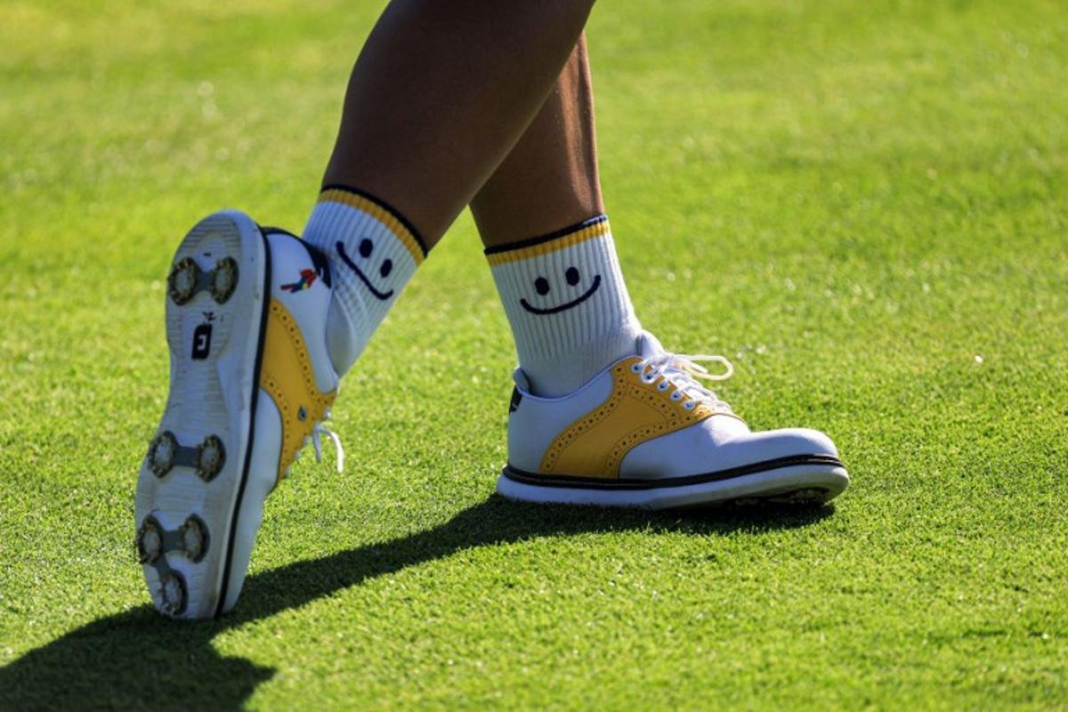 The "smiley" socks of Colombia's Maria Jose Uribe are pictured as she competes in round 2 of the women's golf individual stroke play of the Paris 2024 Olympic Games at Le Golf National in Guyancourt, south-west of Paris on August 8, 2024. Emmanuel DUNAND / AFP