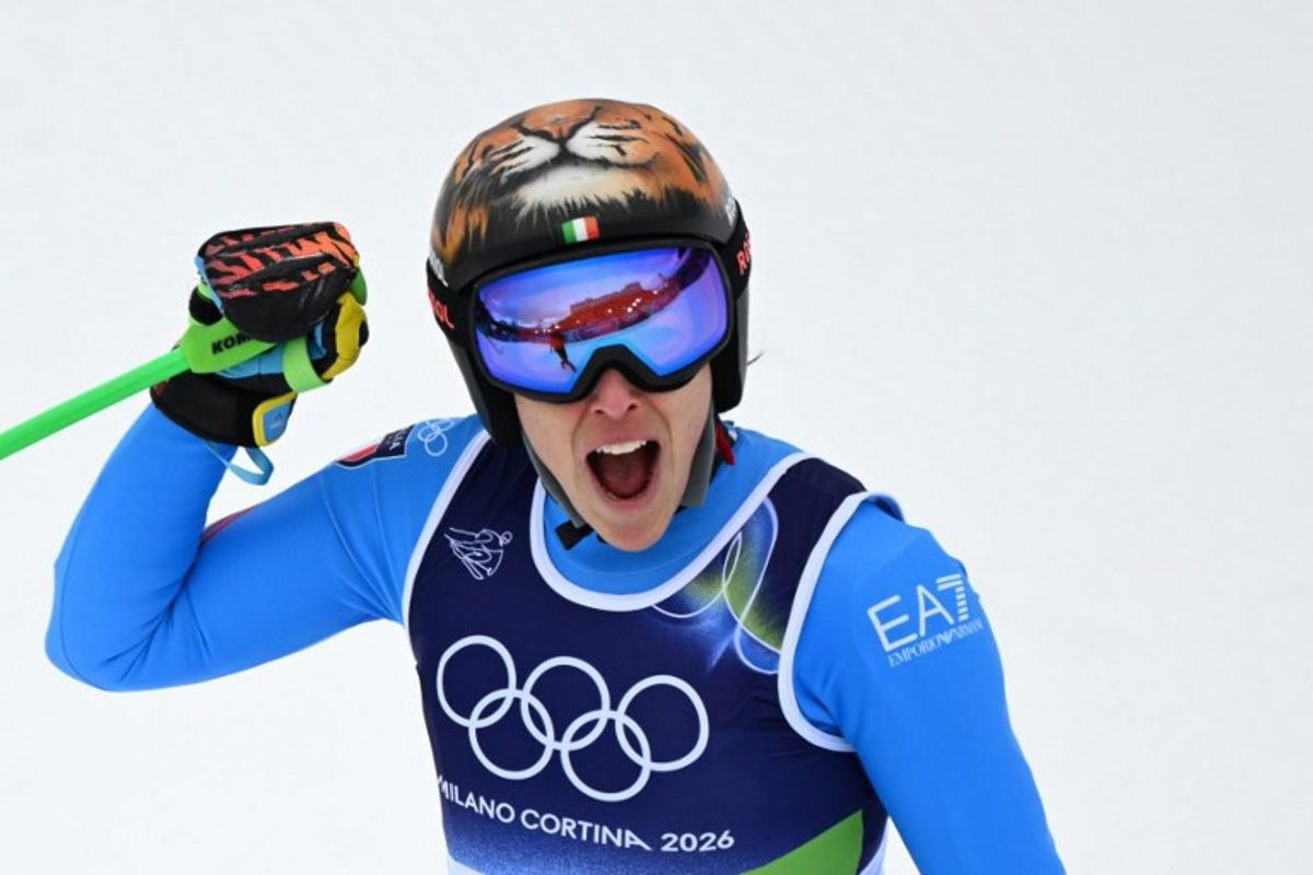 Italy's Federica Brignone reacts in the finish area after competing in on the podium of the women's super-G event during the Milano Cortina 2026 Winter Olympic Games at the Tofane Alpine Skiing Centre in Cortina d'Ampezzo on February 12, 2026. François-Xavier MARIT / AFP