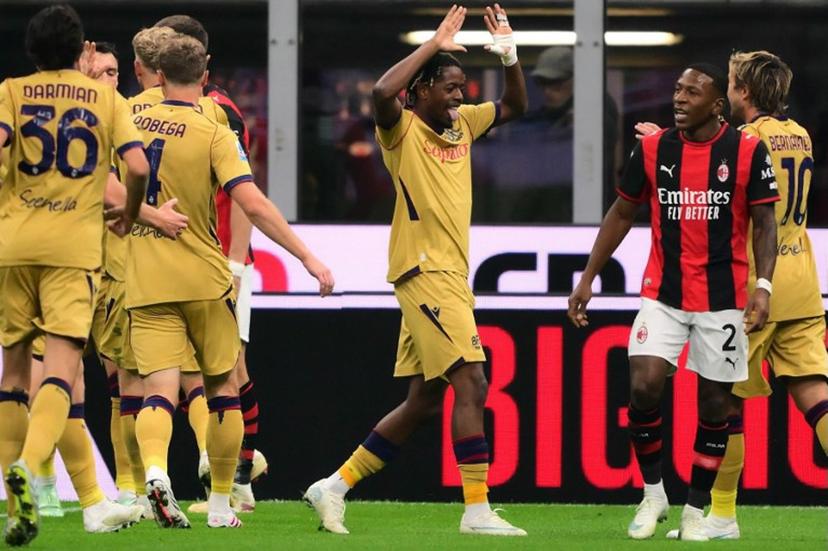 Bologna's Belgian forward #11 Samuel Mbangula (C) celebrates after scoring his team first goal during the Italian Serie A football match between AC Milan and Bologna at the San Siro stadium in Milan, northern Italy on October 28, 2026. Marco Bertorello / AFP