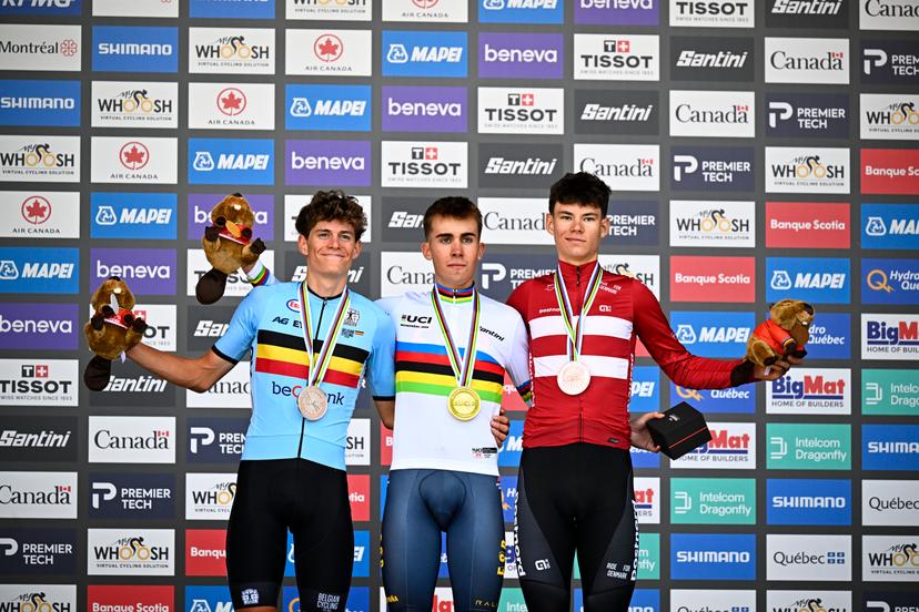 L-R, silver medalist Belgian Vic De Smet, winner with his gold medal Spain's Benjamin Noval and bronze medalist Denmark's Malthe Risbjerg celebrate on the podium of the men's Junior individual time trial race (20,03 km) at the cycling UCI Road World Championship, in Montreal, Canada, Tuesday 22 September 2026. BELGA PHOTO JASPER JACOBS