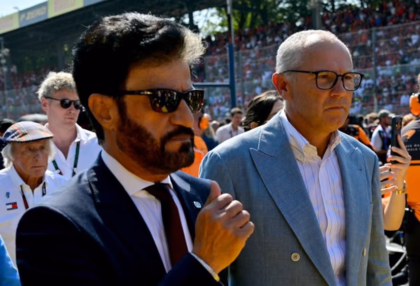 FIA President Mohammed Ben Sulayem (L) walks with Italian CEO of the Formula One Group Stefano Domenicali ahead of the Italian Formula One Grand Prix at the Autodromo Nazionale Monza circuit in Monza, northern Italy on September 6, 2026. Andrej ISAKOVIC / AFP